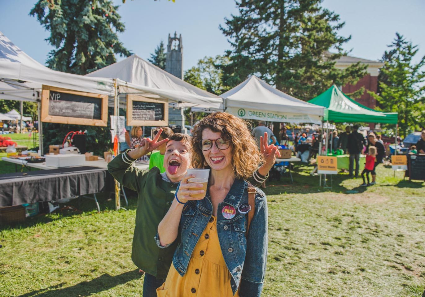 Photographer Jeannette poses with young boy at Cultivate Festival